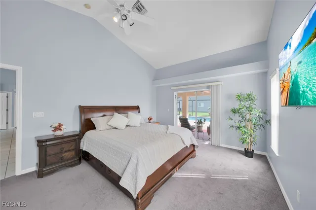 a bed room with a bed and a potted plant