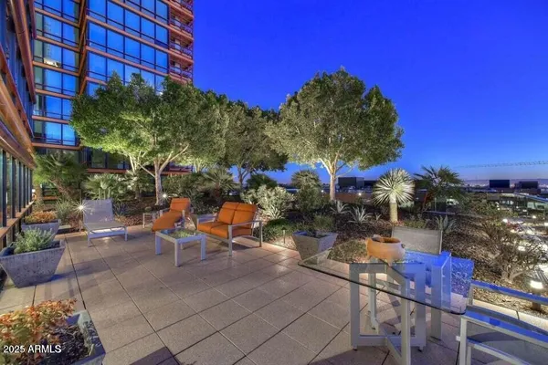 a view of a chairs and table in a patio