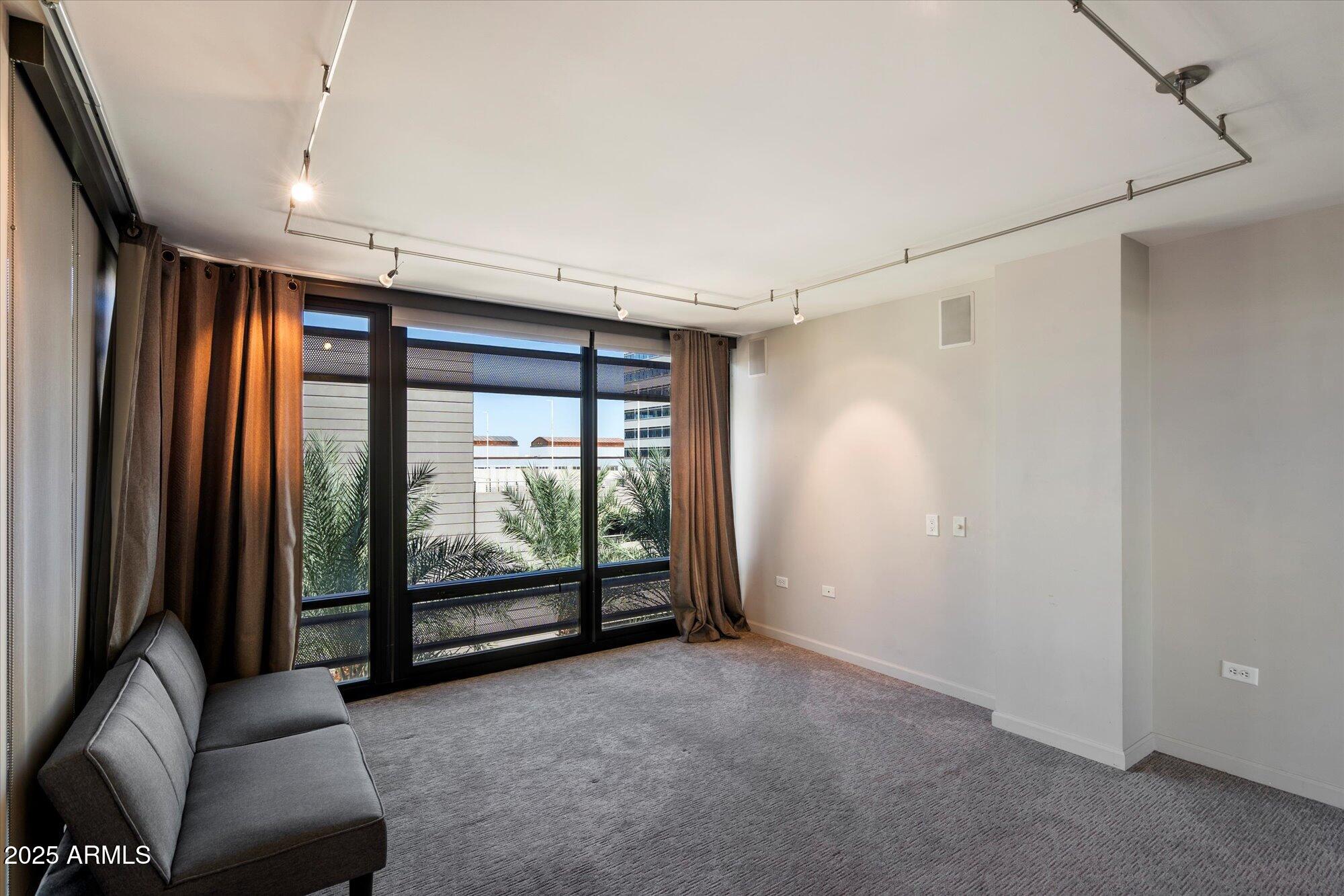 4808 North 24th Street, Unit 627 Phoenix, AZ 85016 - Photo 34 of 57 a view of hallway with furniture and a large window