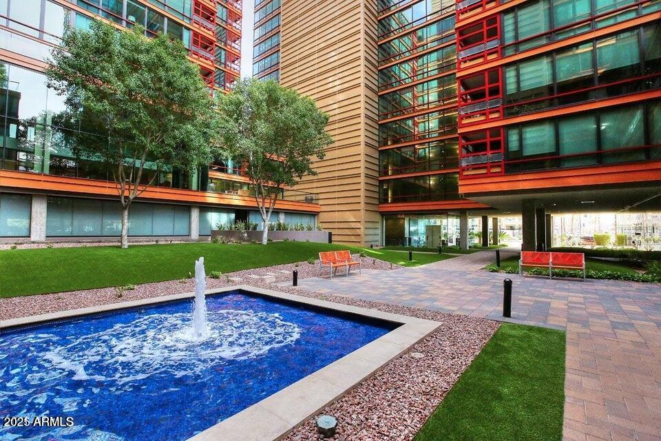 4808 North 24th Street, Unit 627 Phoenix, AZ 85016 - Photo 43 of 57 a wooden bench sitting in front of a building