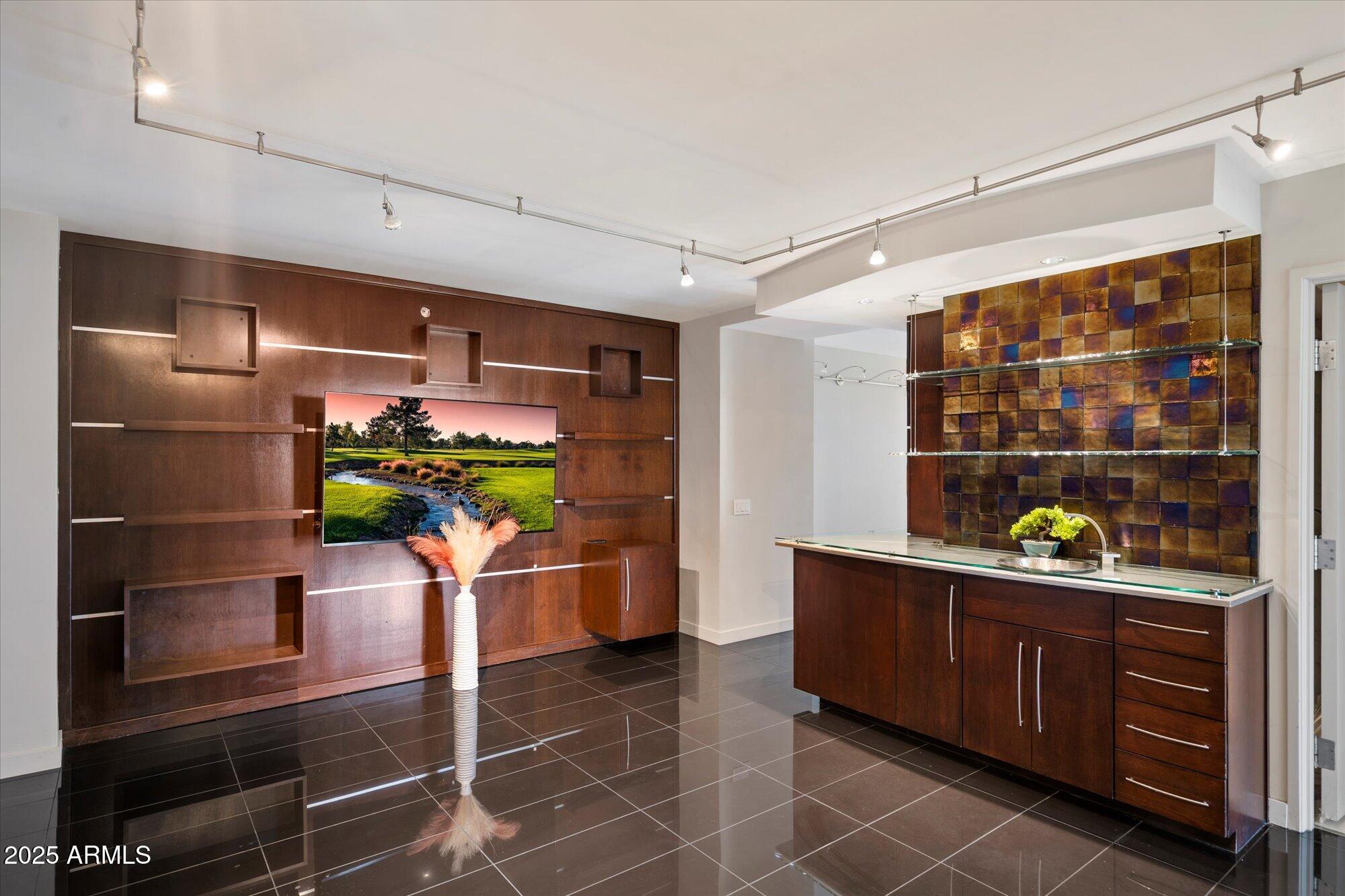 4808 North 24th Street, Unit 627 Phoenix, AZ 85016 - Photo 8 of 57 a room with stainless steel appliances kitchen island granite countertop a refrigerator and a wooden cabinets