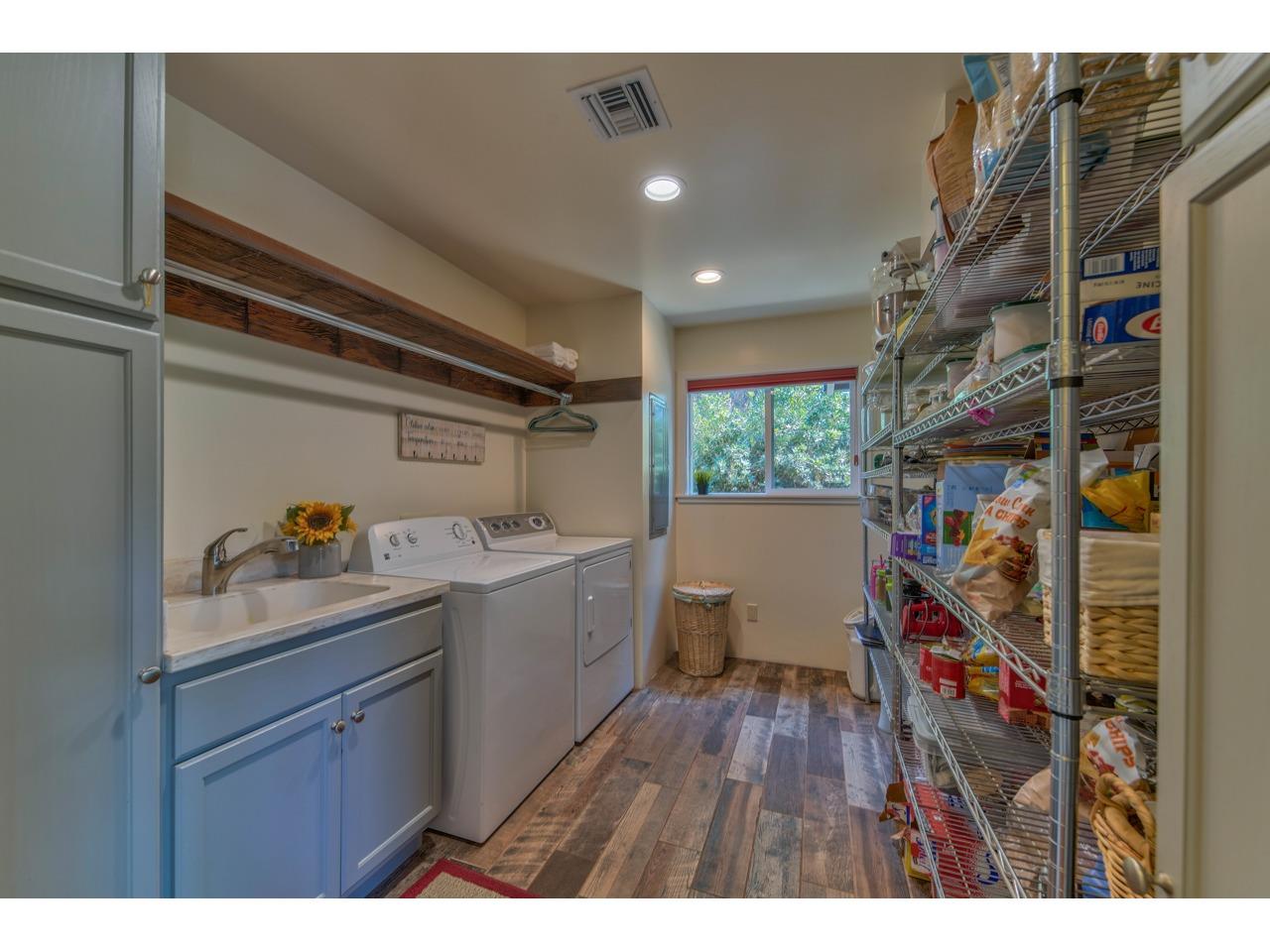 308 West Carmel Valley Road Carmel Valley, CA 93924 - Photo 11 of 49 a storage room with a wooden floor