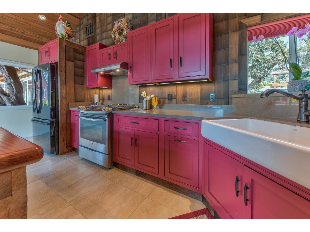 308 West Carmel Valley Road Carmel Valley, CA 93924 - Photo 15 of 49 a kitchen with stainless steel appliances kitchen island granite countertop a stove sink and cabinets
