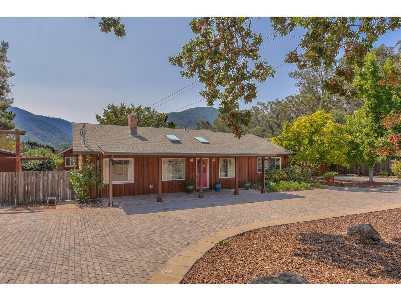 308 West Carmel Valley Road Carmel Valley, CA 93924 - Photo 2 of 49 a front view of a house with a yard