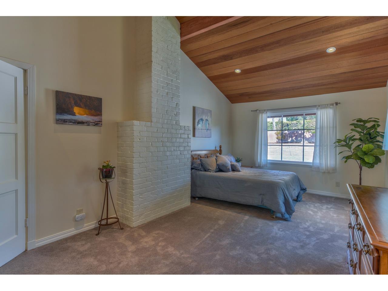 308 West Carmel Valley Road Carmel Valley, CA 93924 - Photo 23 of 49 a living room with furniture and a window