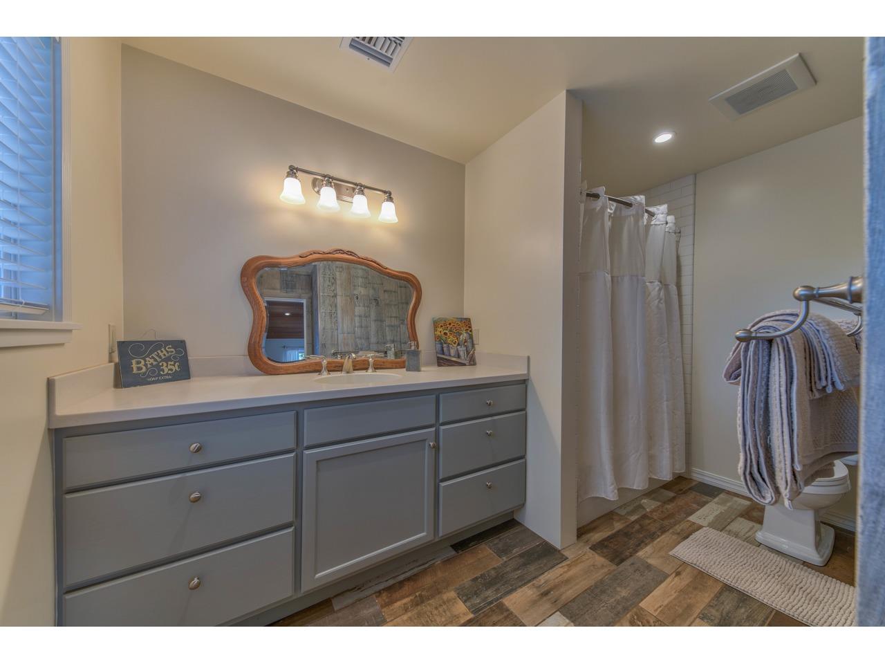 308 West Carmel Valley Road Carmel Valley, CA 93924 - Photo 25 of 49 a bathroom with a sink and a mirror