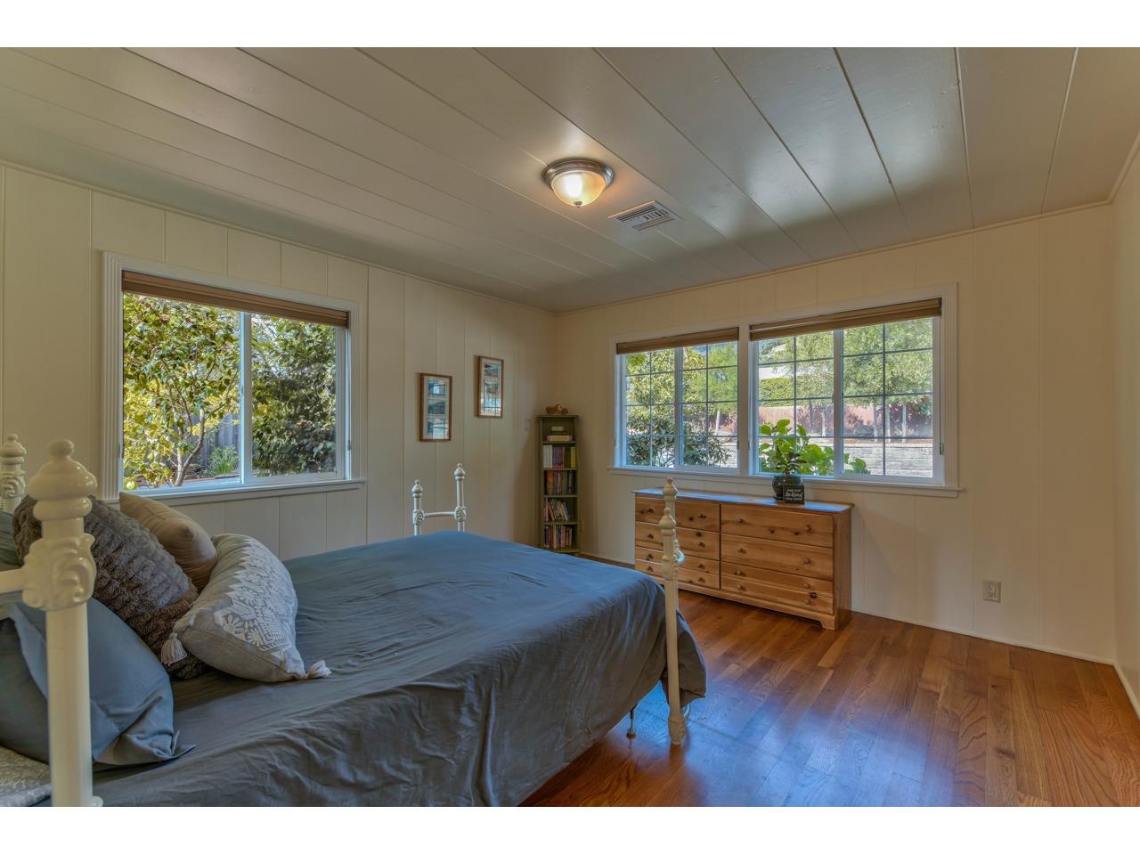 308 West Carmel Valley Road Carmel Valley, CA 93924 - Photo 26 of 49 a living room with a bed furniture and a large window