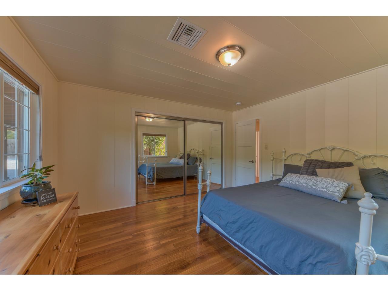 308 West Carmel Valley Road Carmel Valley, CA 93924 - Photo 27 of 49 a bedroom with a bed and a table