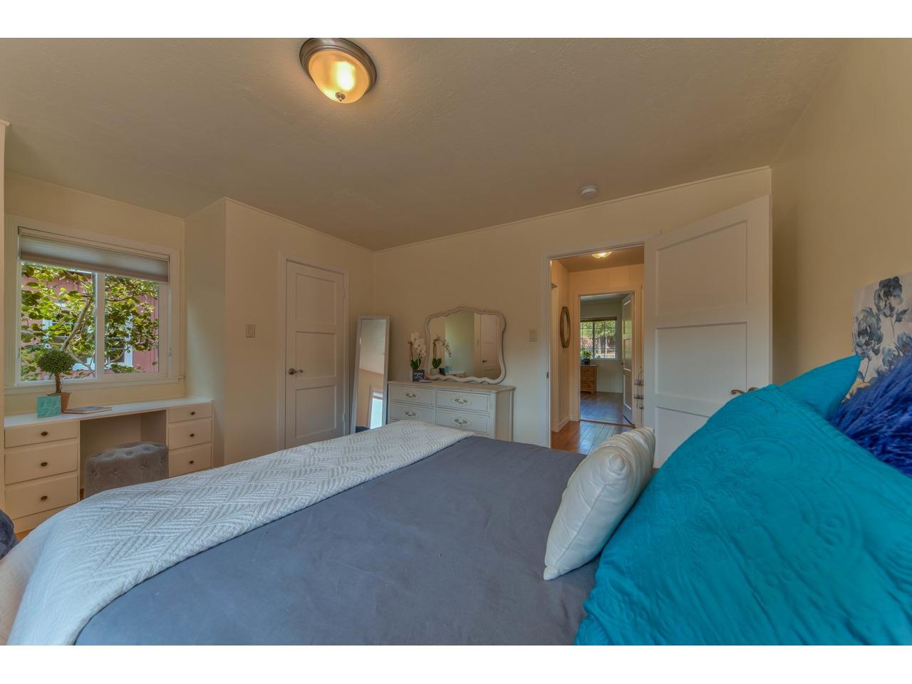 308 West Carmel Valley Road Carmel Valley, CA 93924 - Photo 30 of 49 a bedroom with a bed and a dresser