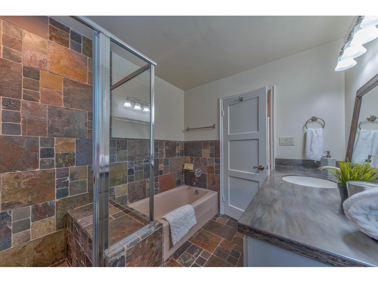 308 West Carmel Valley Road Carmel Valley, CA 93924 - Photo 32 of 49 a bathroom with a sink and a mirror
