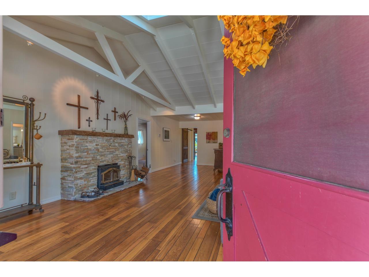 308 West Carmel Valley Road Carmel Valley, CA 93924 - Photo 4 of 49 a view of empty room with fireplace and wooden floor