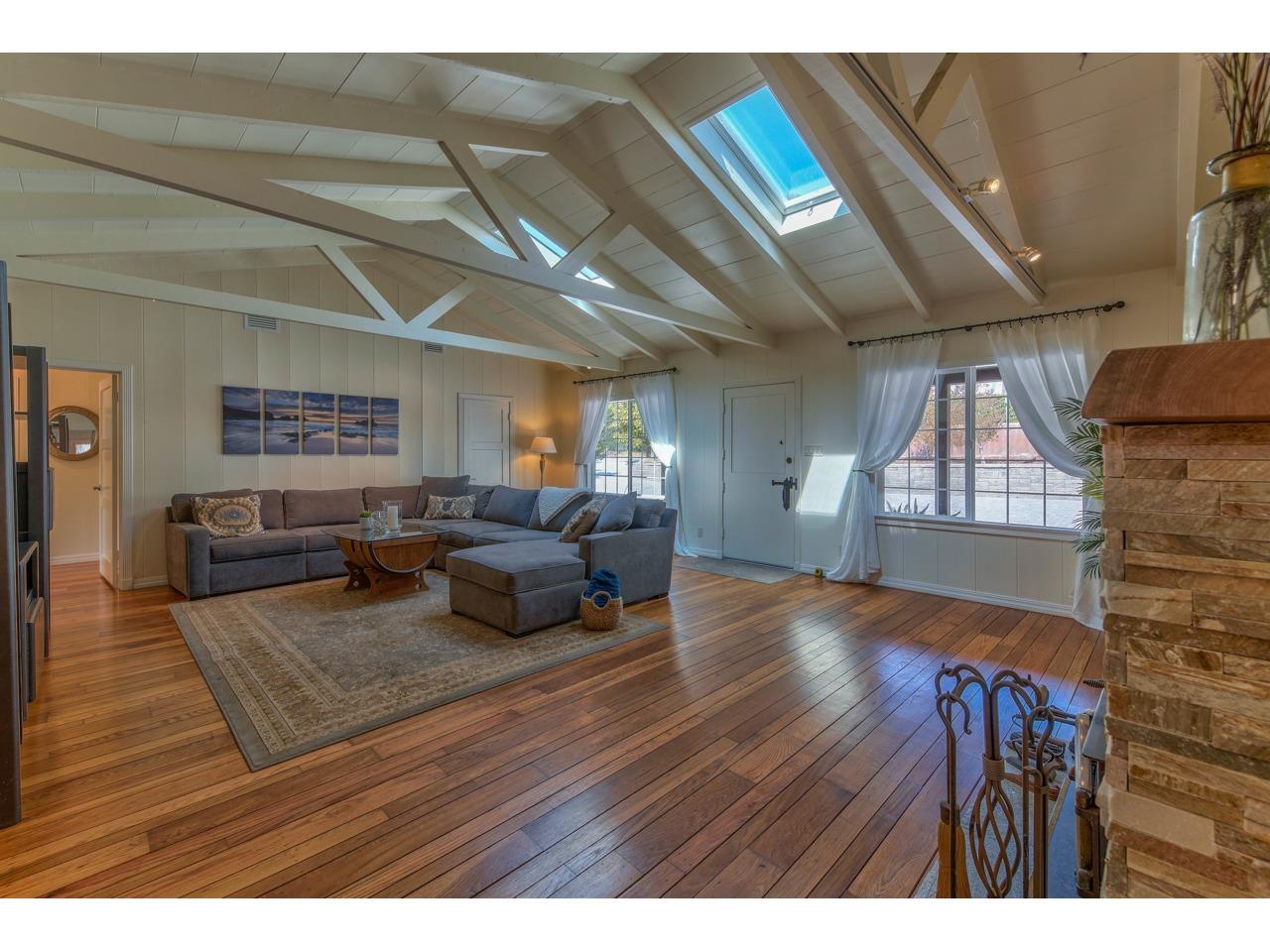 308 West Carmel Valley Road Carmel Valley, CA 93924 - Photo 6 of 49 a living room with furniture and a wooden floor