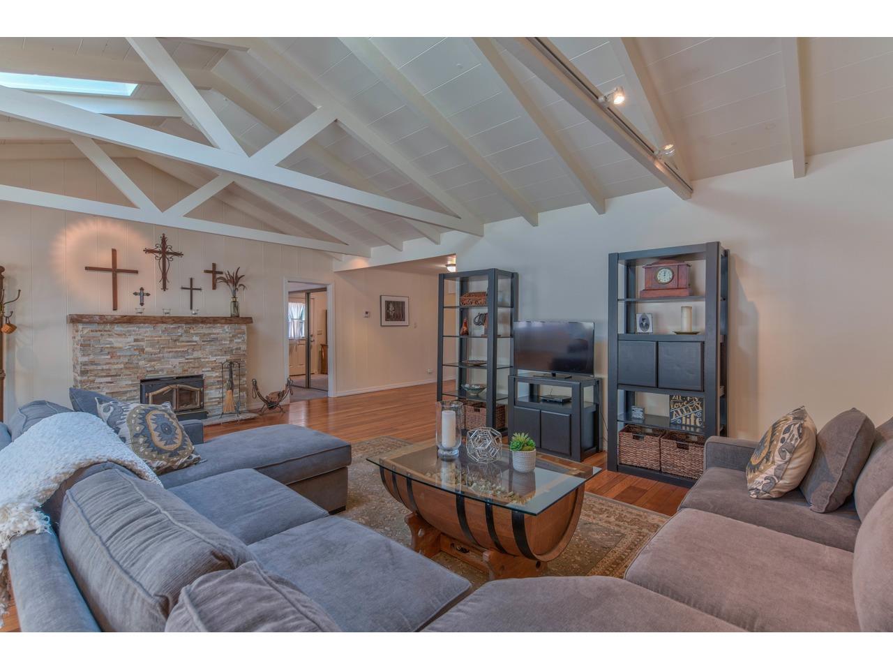 308 West Carmel Valley Road Carmel Valley, CA 93924 - Photo 8 of 49 a living room with furniture and a fireplace