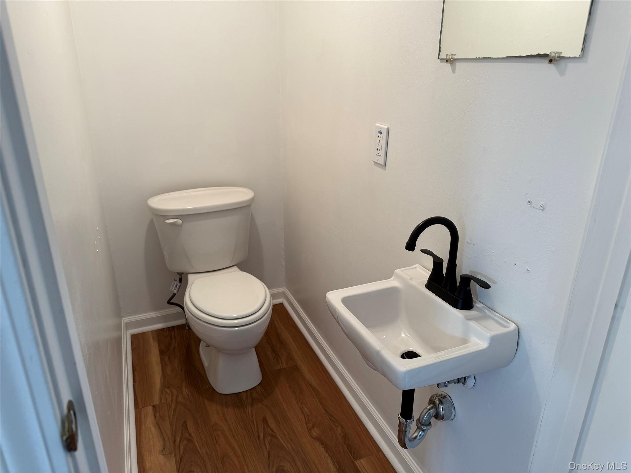 81 Gerald Drive Poughkeepsie, NY 12601 - Photo 5 of 20 a bathroom with a toilet sink and mirror