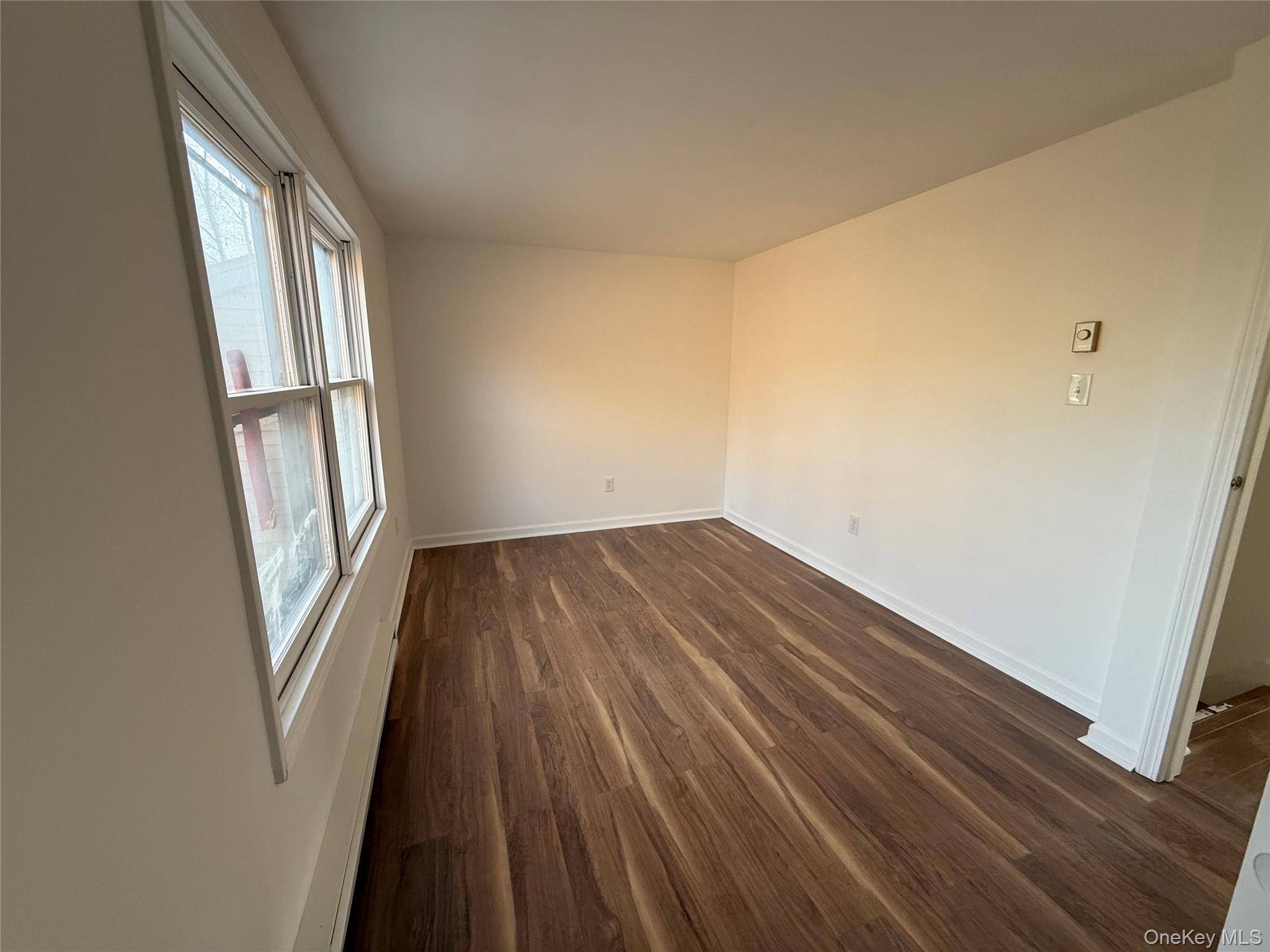 81 Gerald Drive Poughkeepsie, NY 12601 - Photo 9 of 20 wooden floor in an empty room with a window