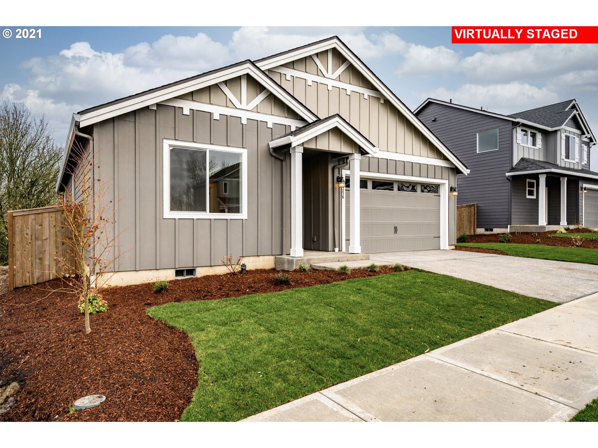 8528 North 5th Street, Unit LT31 Ridgefield, WA 98642 - Photo 2 of 31 a front view of a house with a yard and garage