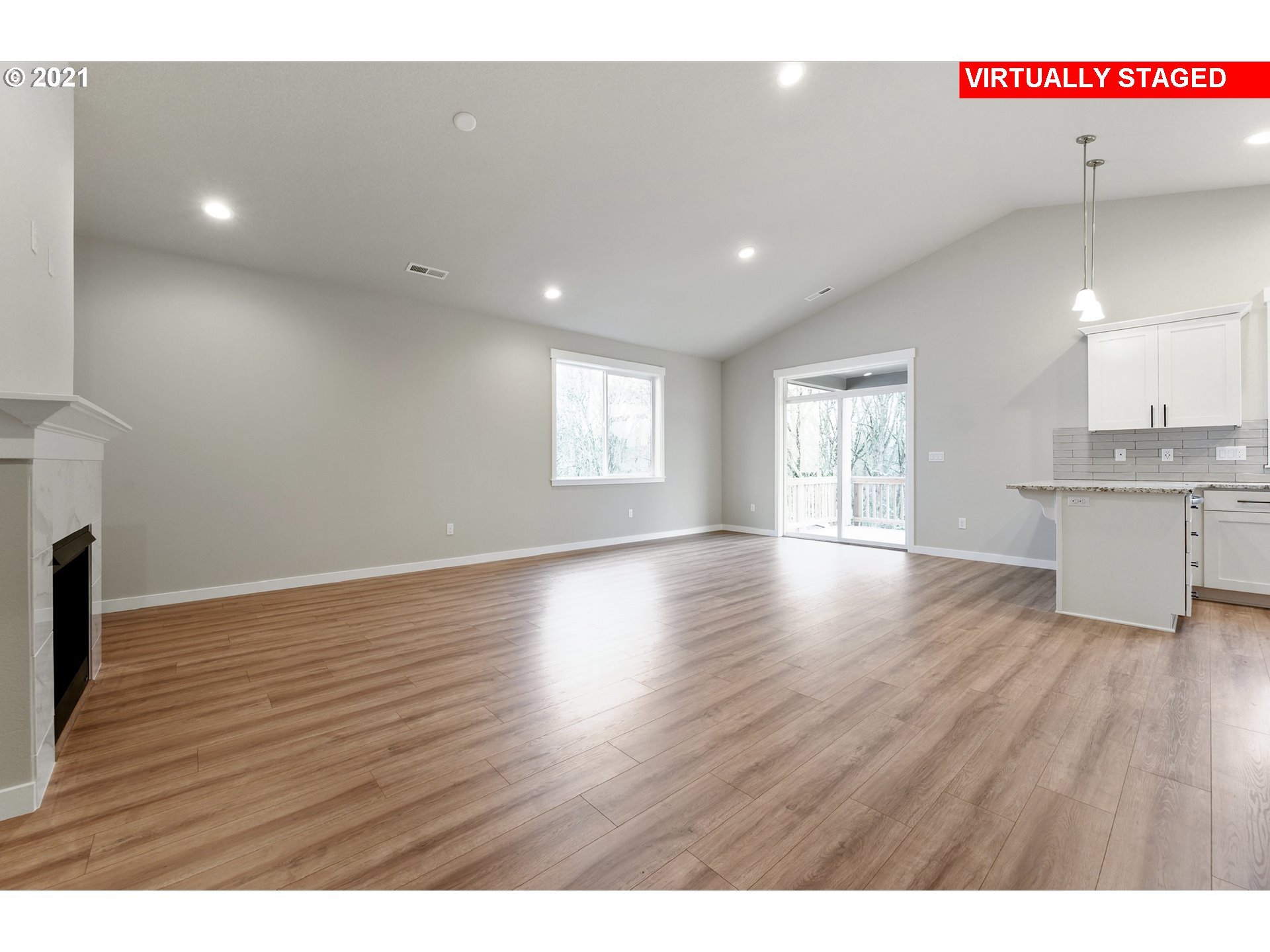 8528 North 5th Street, Unit LT31 Ridgefield, WA 98642 - Photo 25 of 31 a view of an empty room with wooden floor and a window