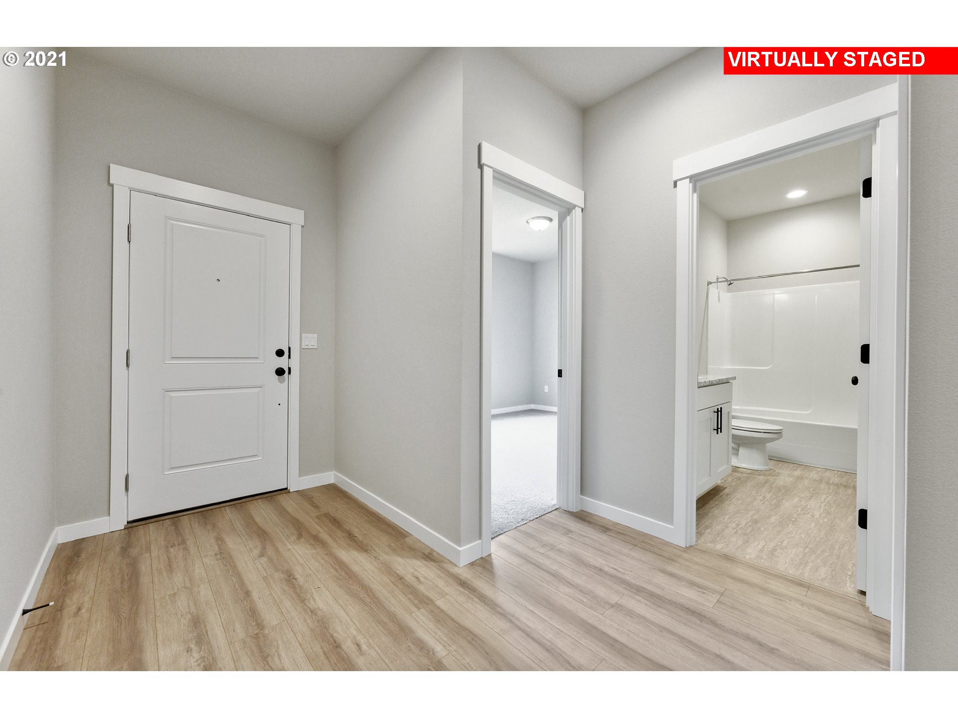 8528 North 5th Street, Unit LT31 Ridgefield, WA 98642 - Photo 4 of 31 a view of an empty room and wooden floor