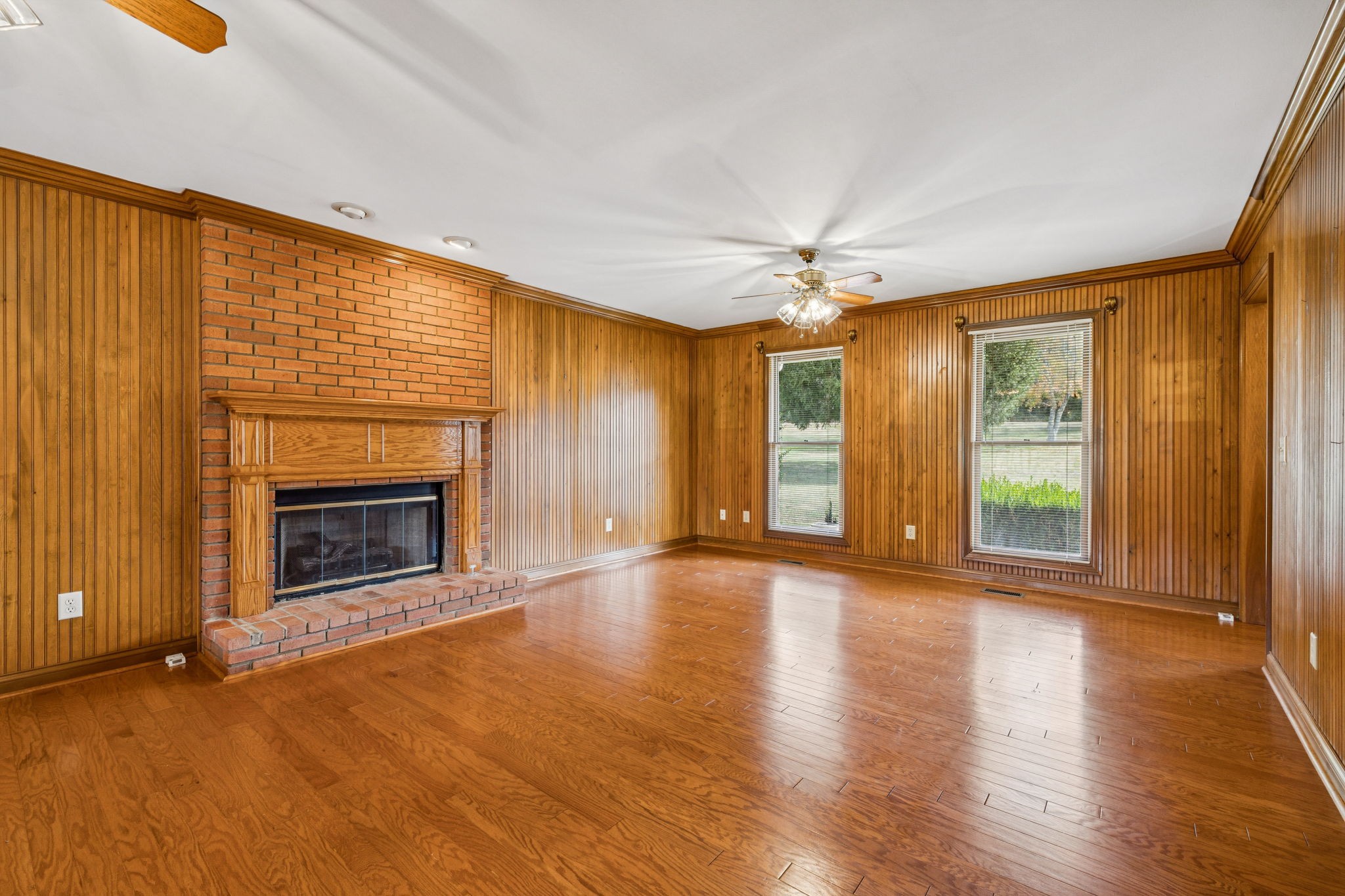 7935 Old Springfield Pike Goodlettsville, TN 37072 - Photo 12 of 82 a view of an empty room with a fireplace and a window