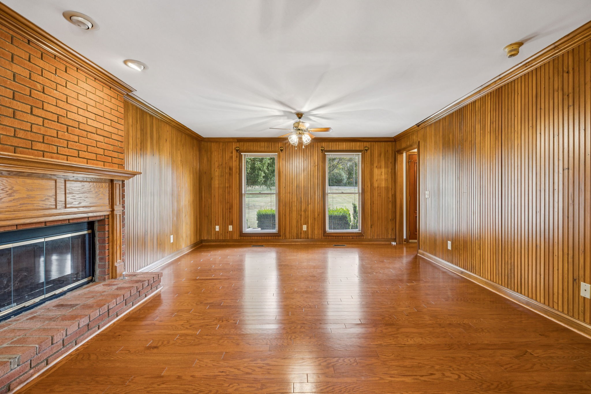 7935 Old Springfield Pike Goodlettsville, TN 37072 - Photo 14 of 82 a view of an empty room with a fireplace and a window