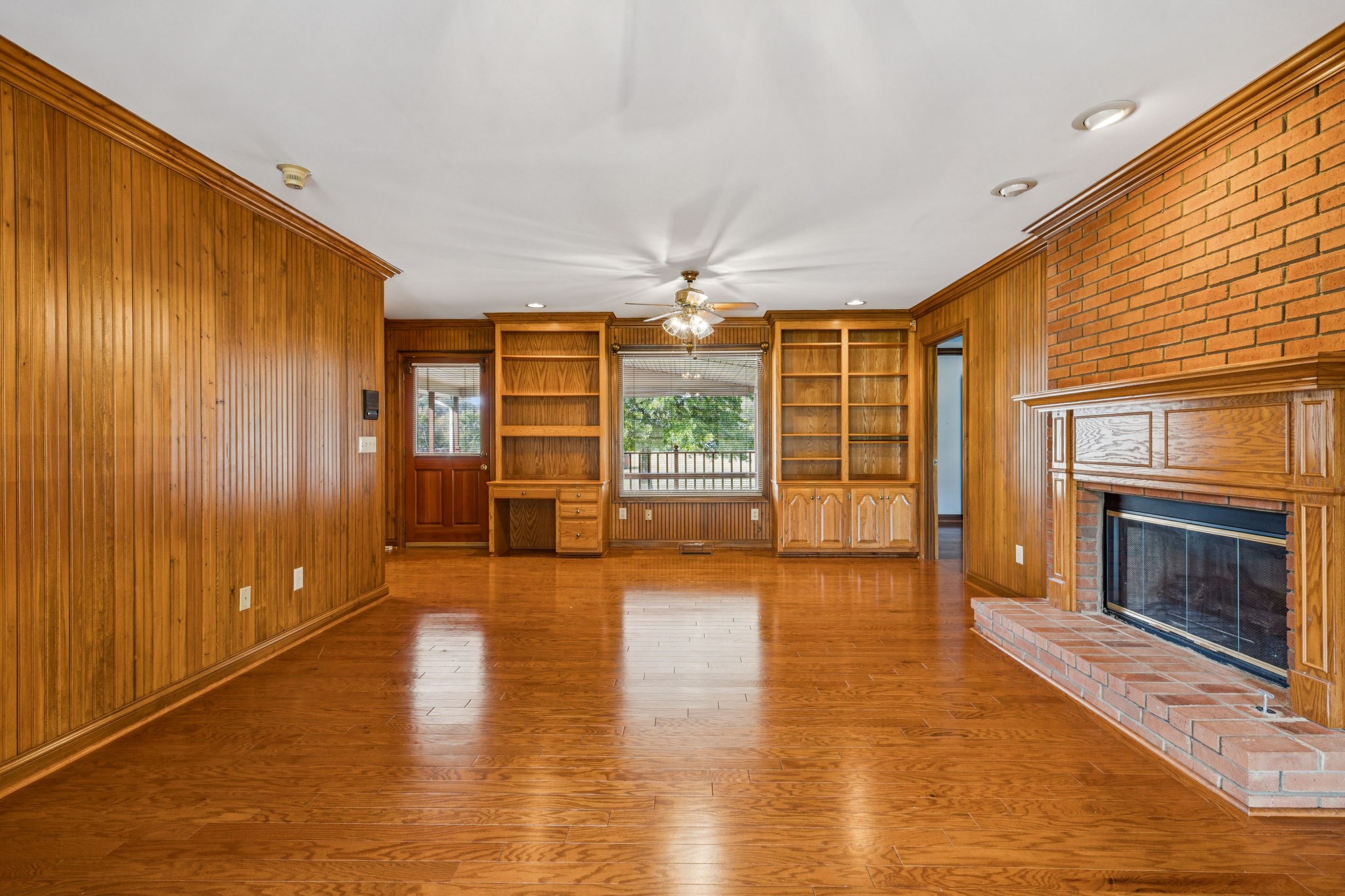 7935 Old Springfield Pike Goodlettsville, TN 37072 - Photo 18 of 82 a view of an empty room with window and wooden floor