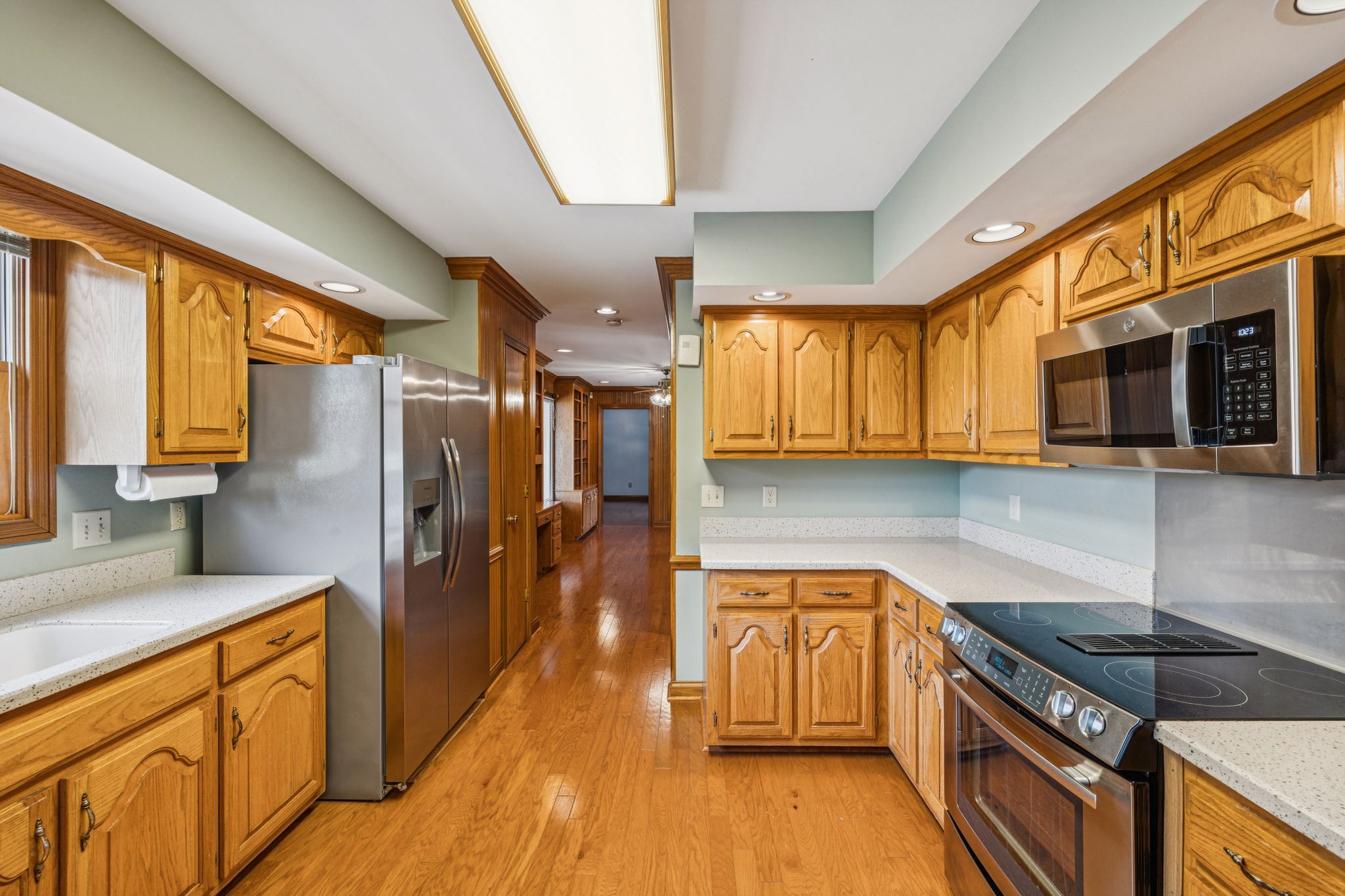 7935 Old Springfield Pike Goodlettsville, TN 37072 - Photo 23 of 82 a kitchen with stainless steel appliances granite countertop a stove a sink and a microwave