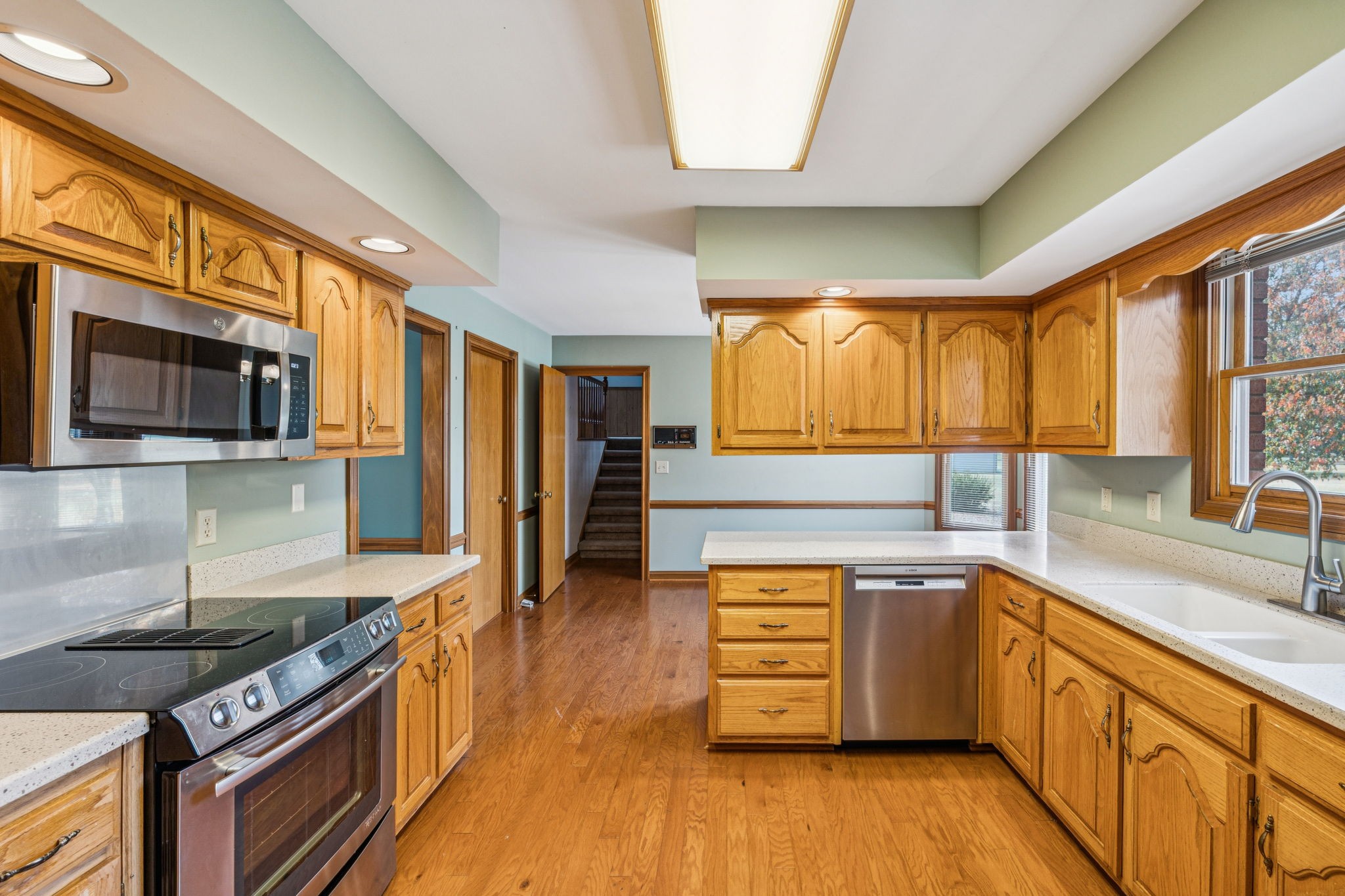 7935 Old Springfield Pike Goodlettsville, TN 37072 - Photo 24 of 82 a kitchen with stainless steel appliances a stove a sink and a microwave