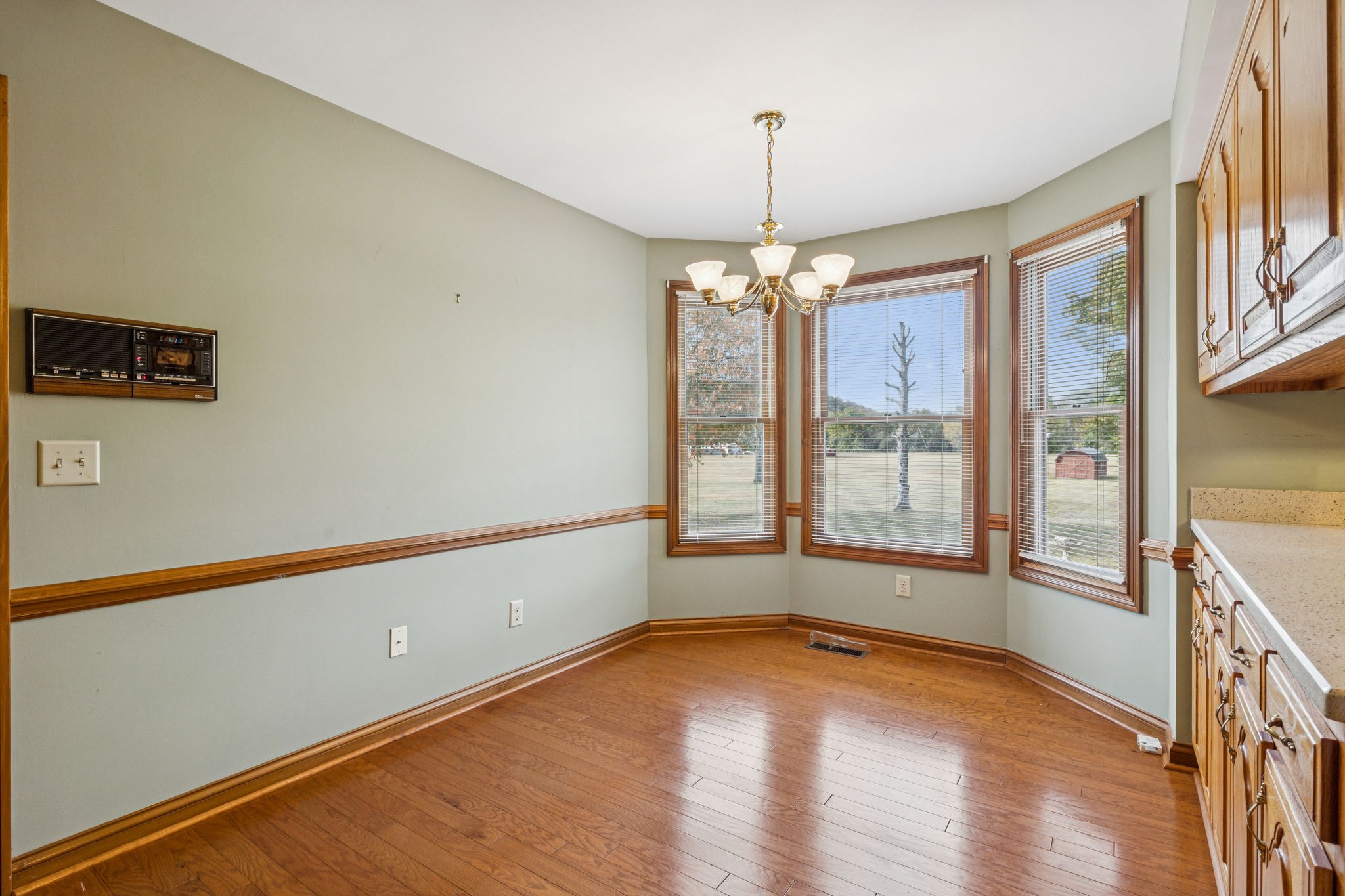 7935 Old Springfield Pike Goodlettsville, TN 37072 - Photo 27 of 82 a view of an empty room with a window and wooden floor