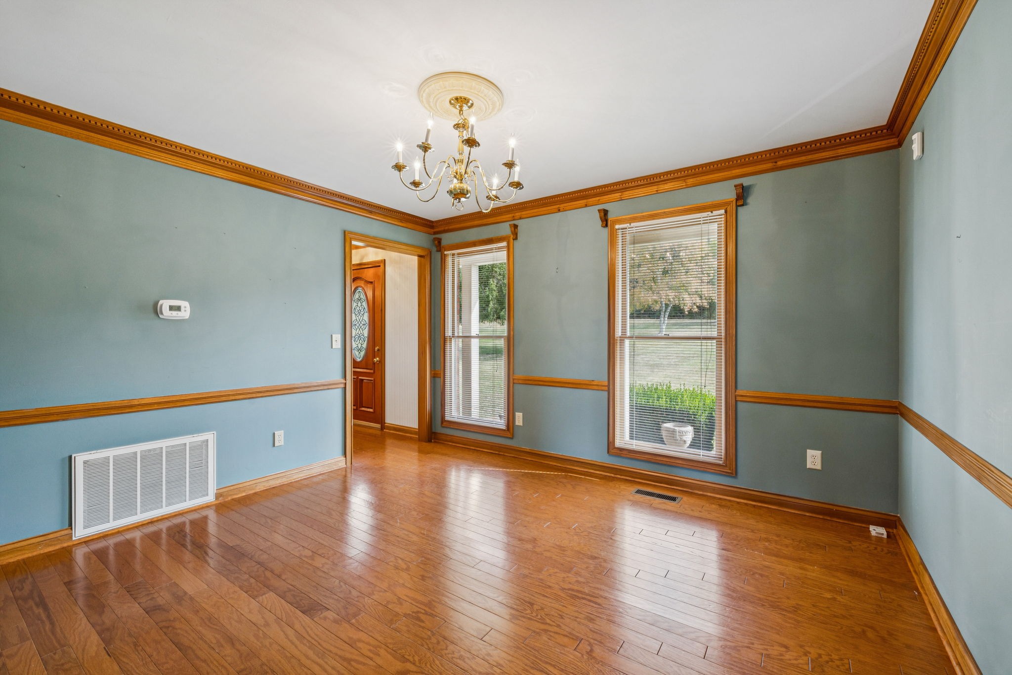 7935 Old Springfield Pike Goodlettsville, TN 37072 - Photo 29 of 82 a view of an empty room with a window and wooden floor