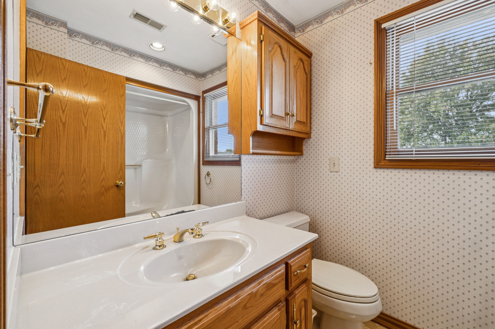 7935 Old Springfield Pike Goodlettsville, TN 37072 - Photo 42 of 82 a bathroom with a sink toilet and shower