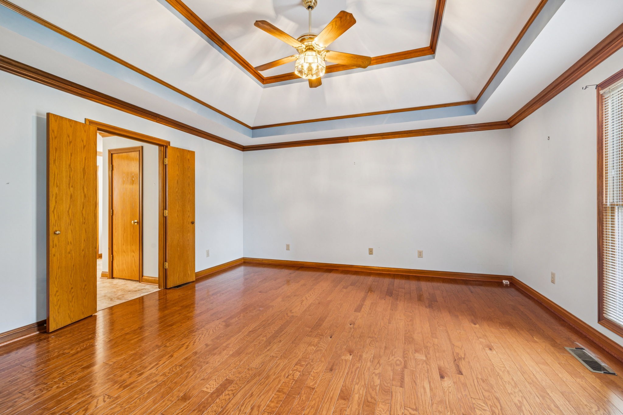 7935 Old Springfield Pike Goodlettsville, TN 37072 - Photo 46 of 82 a view of an empty room with window and wooden floor