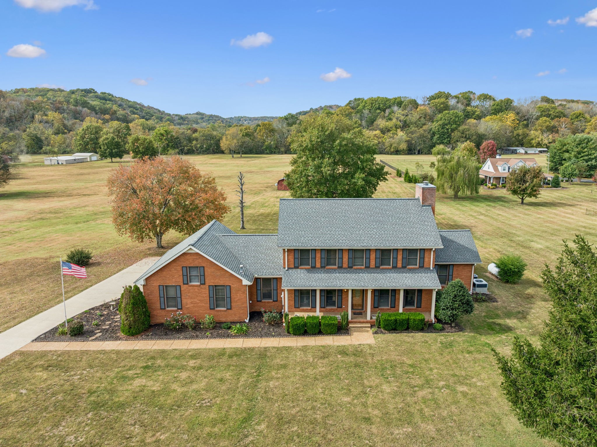 7935 Old Springfield Pike Goodlettsville, TN 37072 - Photo 70 of 82 a front view of a house with a yard and lake view