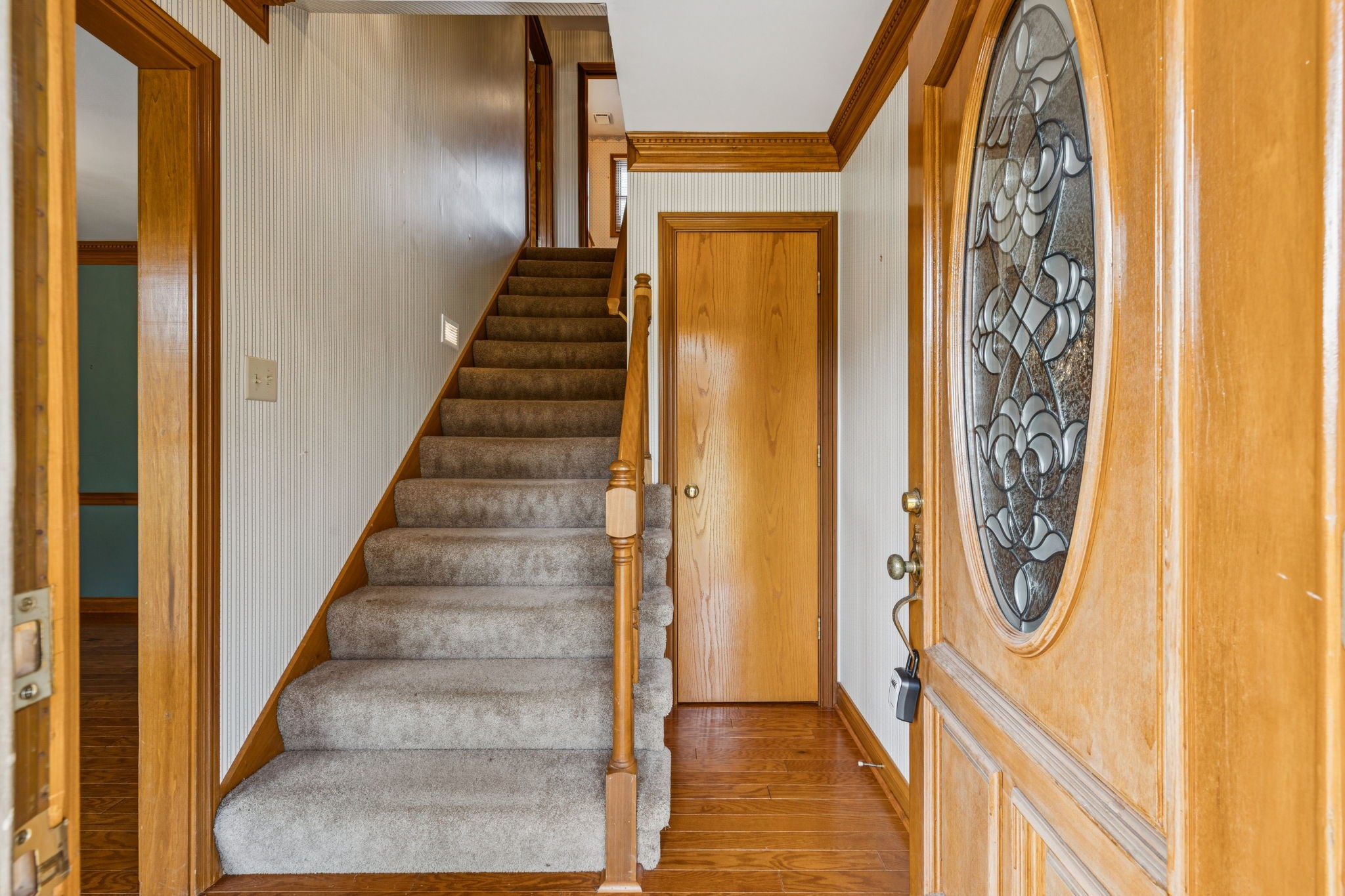 7935 Old Springfield Pike Goodlettsville, TN 37072 - Photo 7 of 82 a view of a hallway with wooden floor and entryway