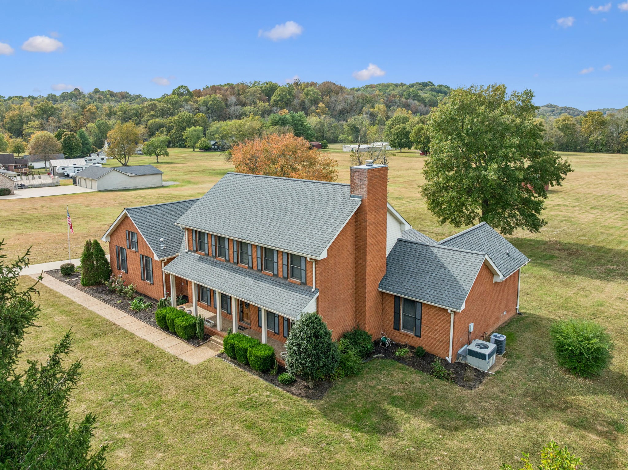 7935 Old Springfield Pike Goodlettsville, TN 37072 - Photo 71 of 82 a aerial view of a house with a garden and a yard
