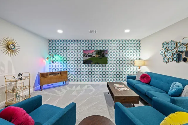 a living room with furniture and a flat screen tv