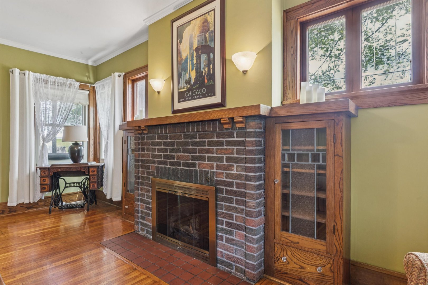 1818 23rd Street Rock Island, IL 61201 - Photo 11 of 55 a living room with a fireplace and a window