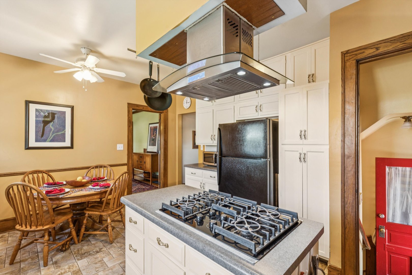 1818 23rd Street Rock Island, IL 61201 - Photo 16 of 55 a kitchen with stainless steel appliances granite countertop a sink a stove a refrigerator and wooden floor