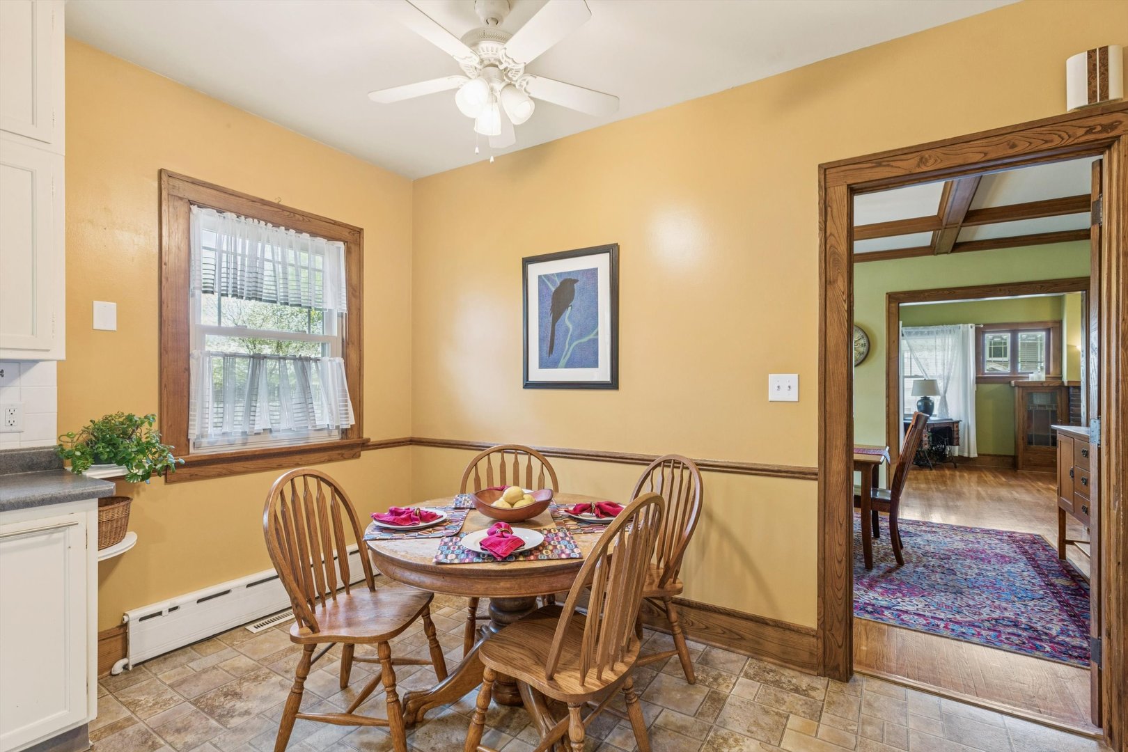 1818 23rd Street Rock Island, IL 61201 - Photo 19 of 55 a view of a dining room with furniture and a potted plant