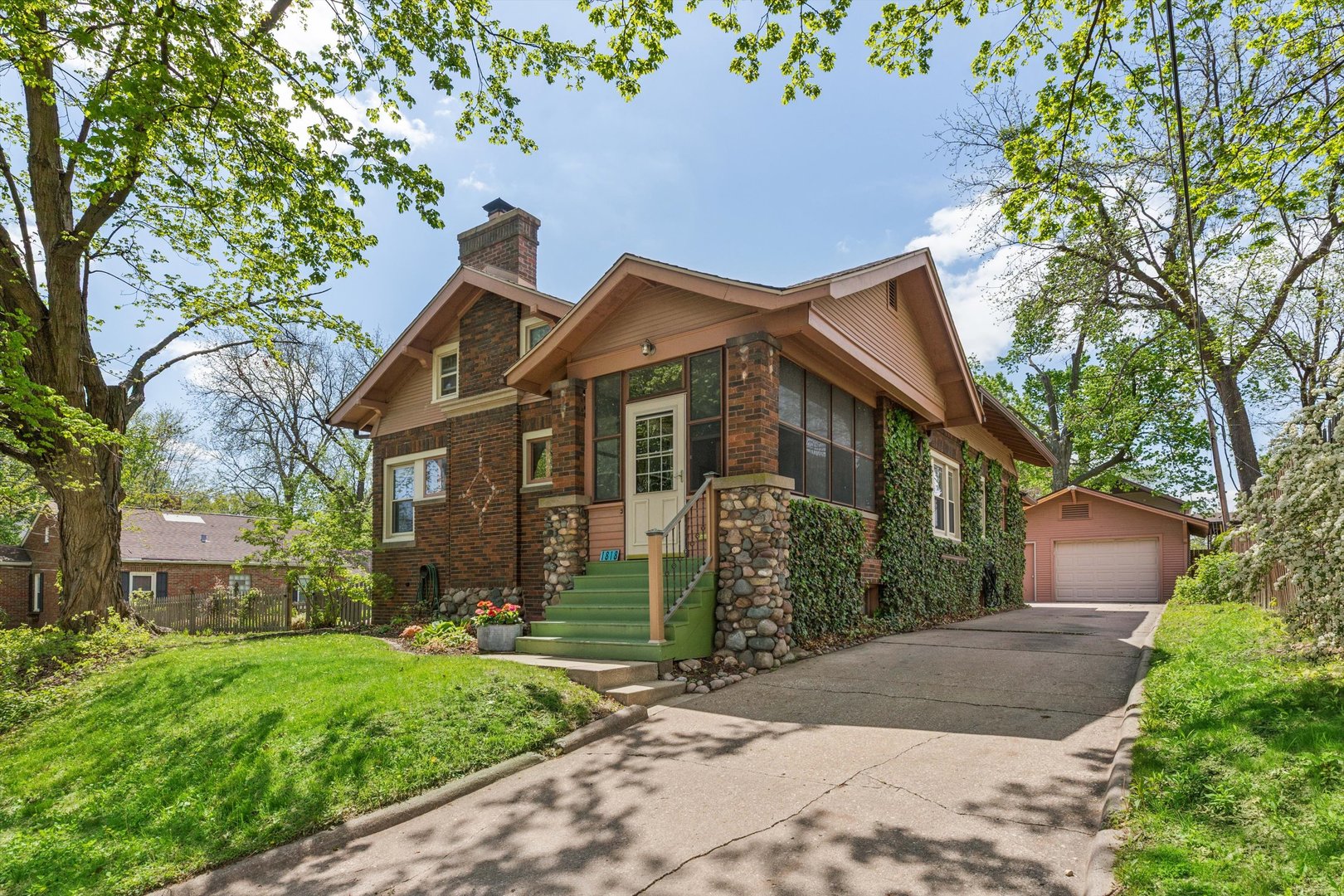 1818 23rd Street Rock Island, IL 61201 - Photo 2 of 55 a front view of a house with a garden