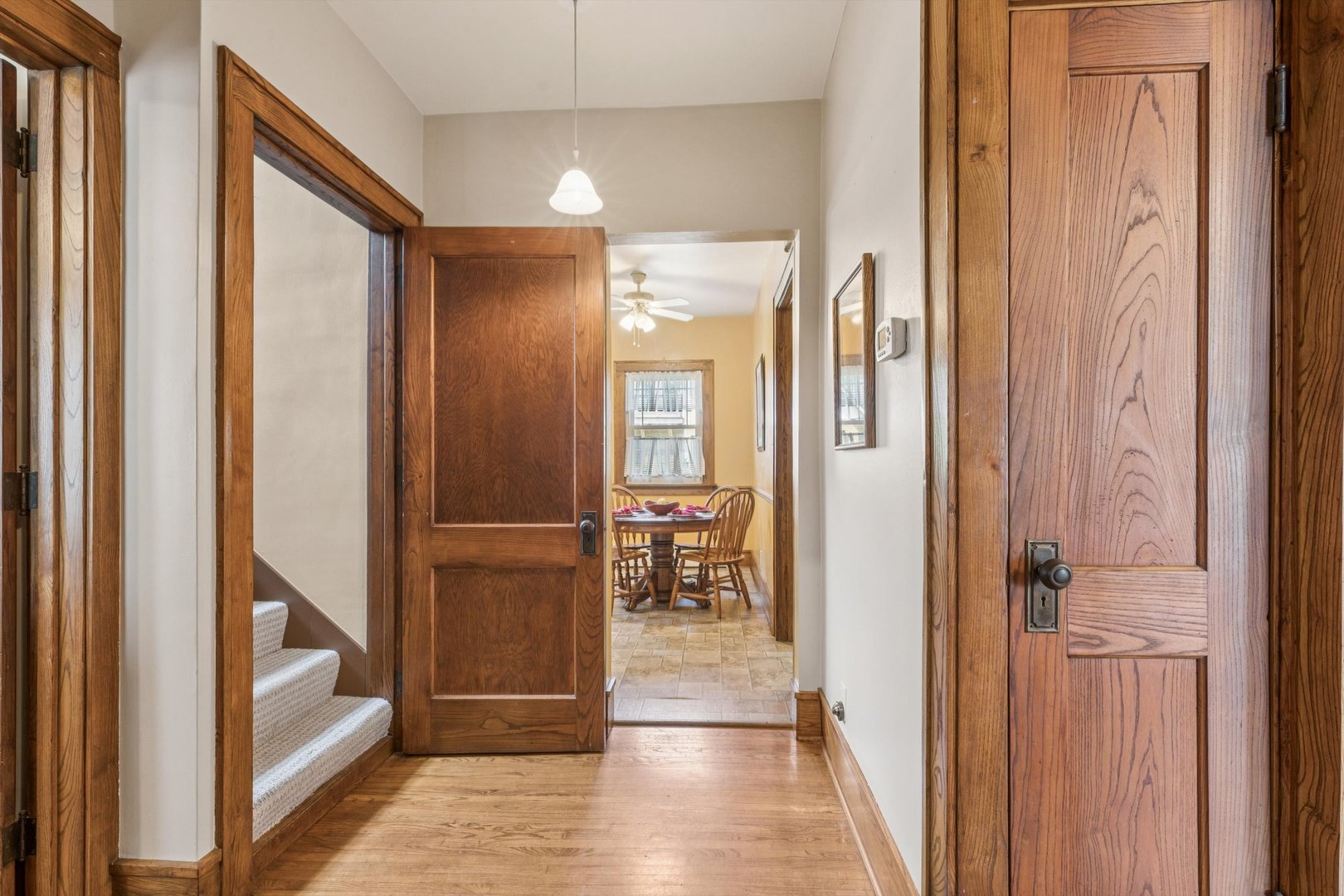 1818 23rd Street Rock Island, IL 61201 - Photo 21 of 55 a view of a hallway with wooden floor and staircase