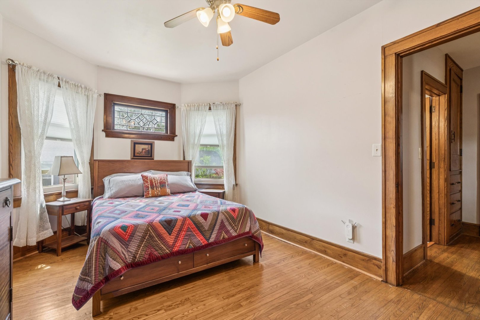 1818 23rd Street Rock Island, IL 61201 - Photo 24 of 55 a bedroom with a bed and a chandelier
