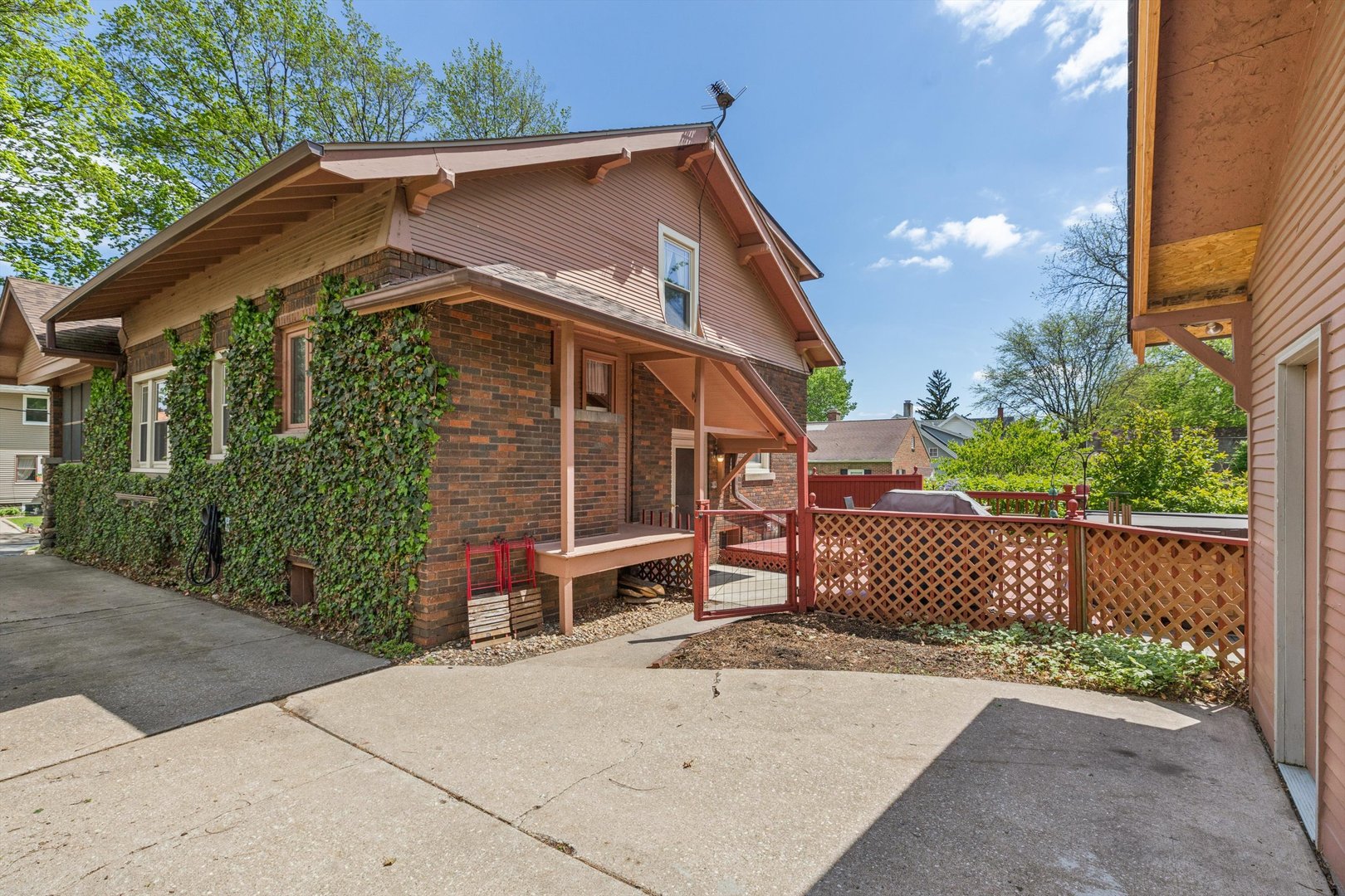 1818 23rd Street Rock Island, IL 61201 - Photo 42 of 55 a backyard of a house with a garden and deck