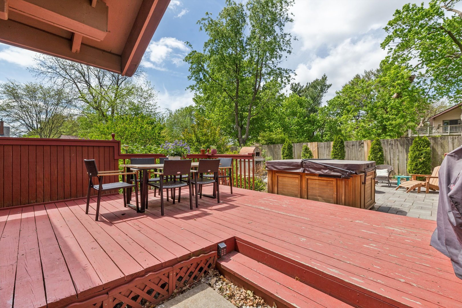 1818 23rd Street Rock Island, IL 61201 - Photo 43 of 55 a view of a patio with dining table and chairs with wooden floor and fence