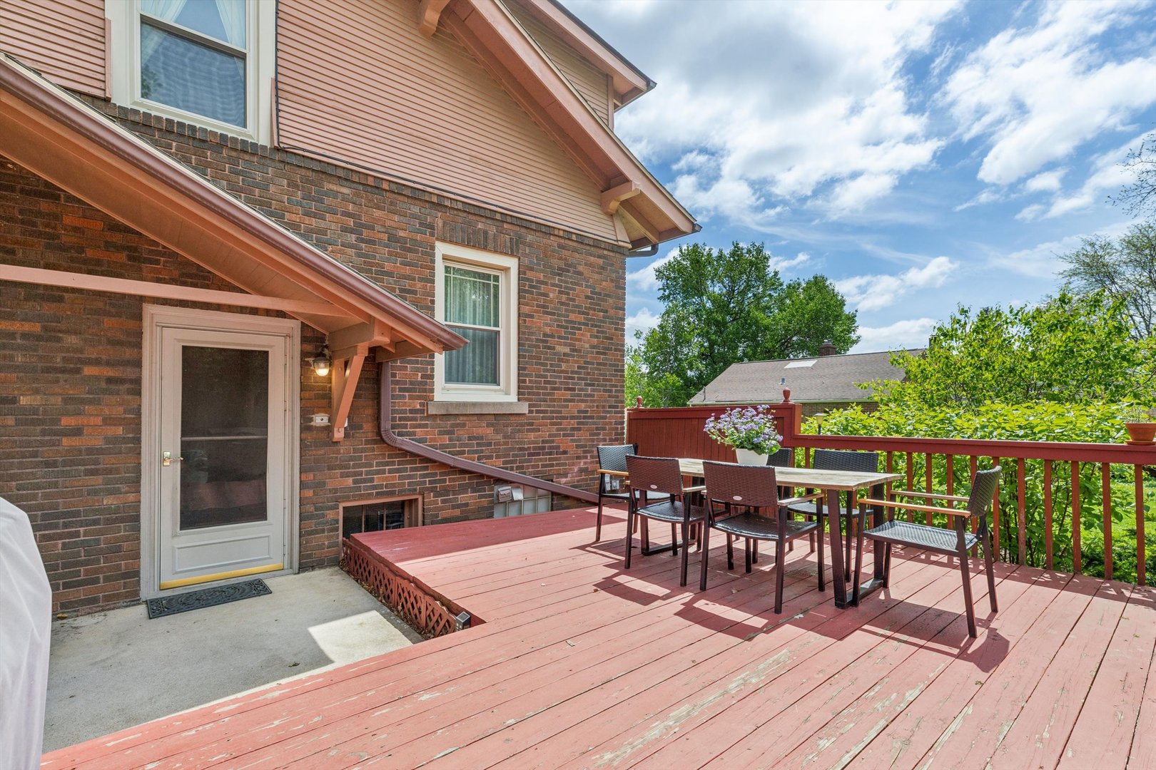 1818 23rd Street Rock Island, IL 61201 - Photo 44 of 55 a roof deck with table and chairs potted plants with wooden floor