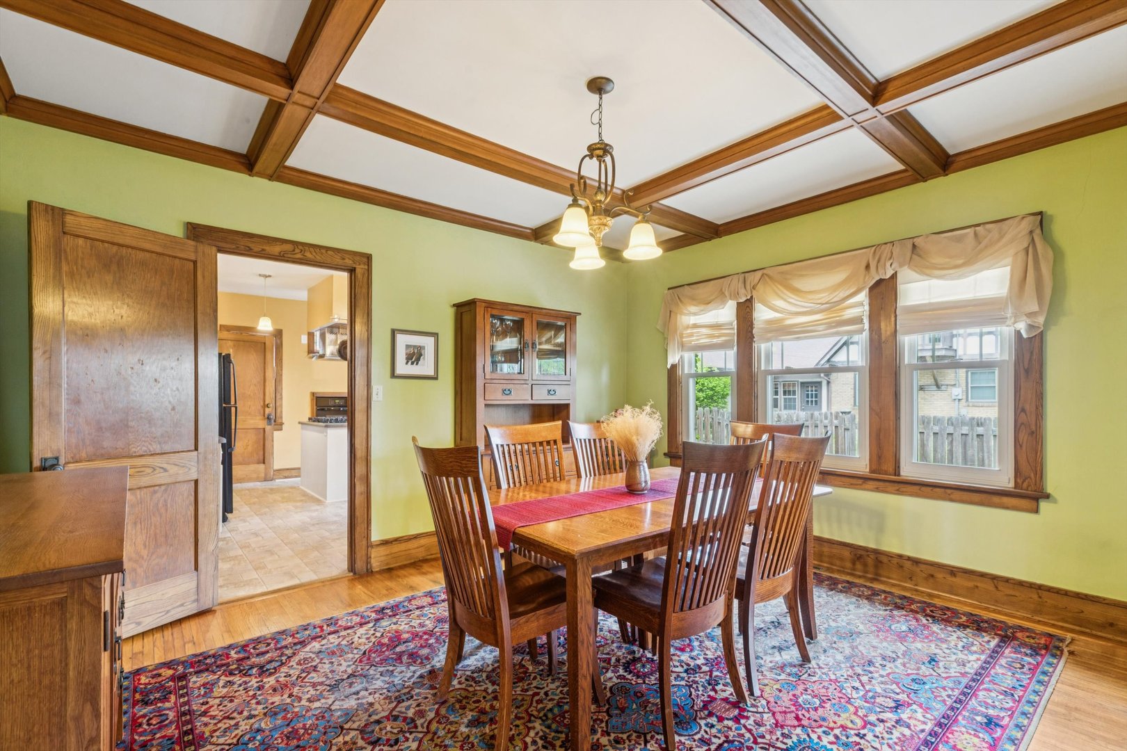 1818 23rd Street Rock Island, IL 61201 - Photo 8 of 55 a view of a dining room with furniture window and wooden floor