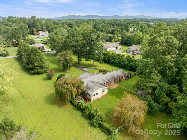 a view of a lake with a yard