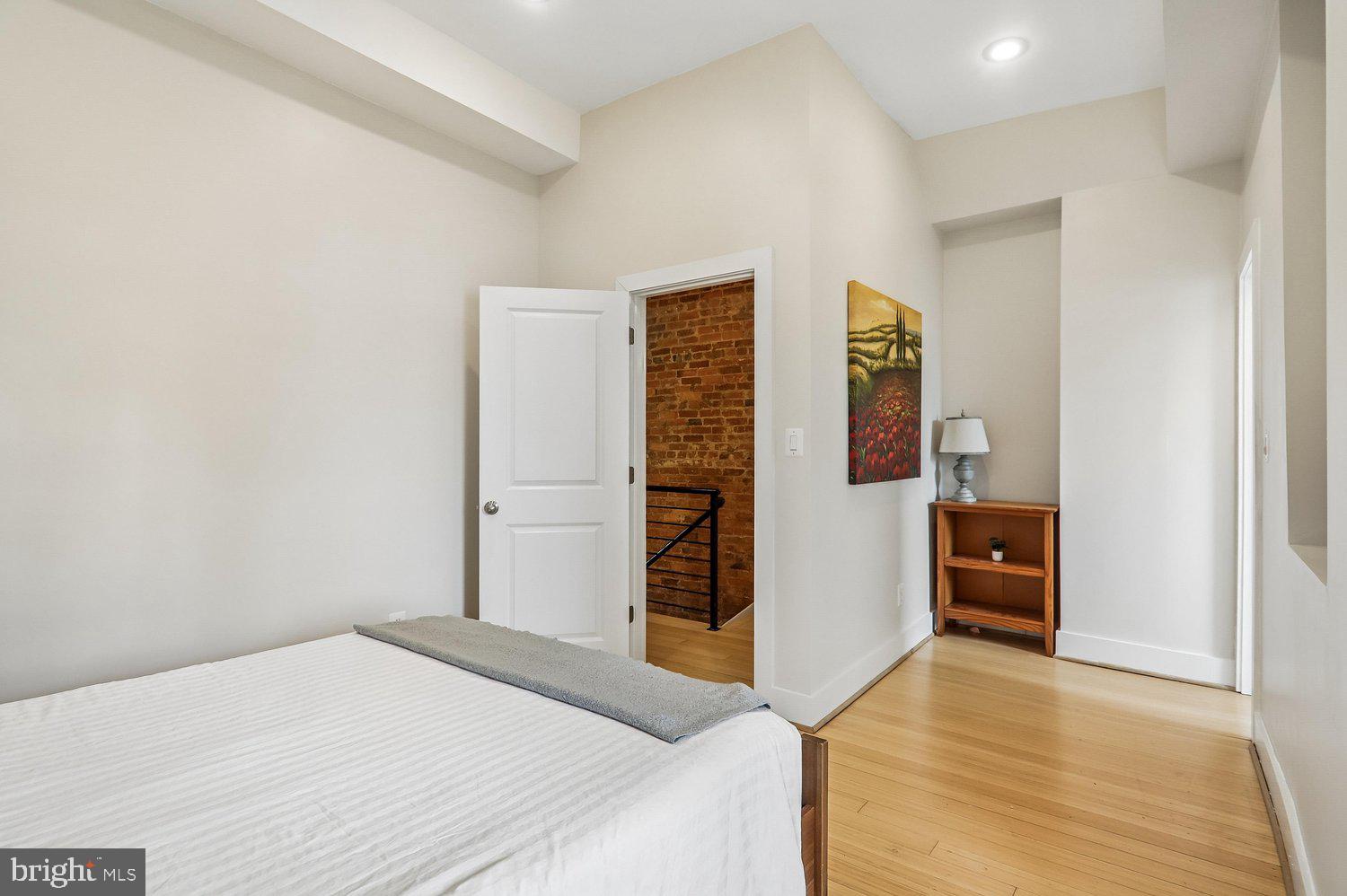 911 L Street Northeast Washington, DC 20002 - Photo 24 of 48 a bedroom with a bed and furniture