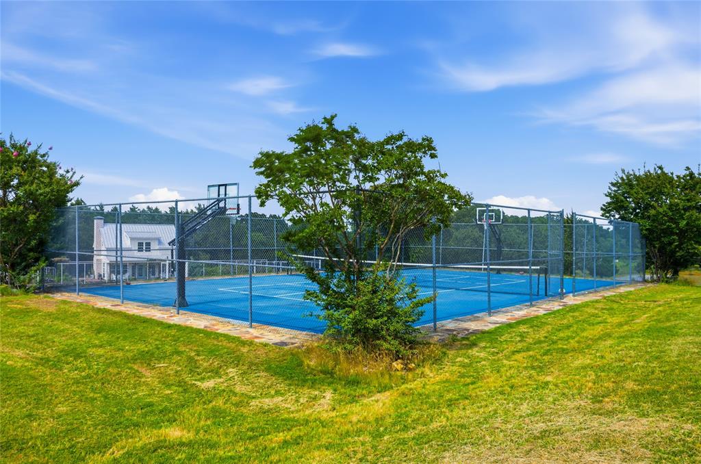1073 Gordonville Road Gordonville, TX 76245 - Photo 31 of 38 What a fun addition! This fenced pickleball area could be marked for tennis as well. Family and guests can all have some fun here!