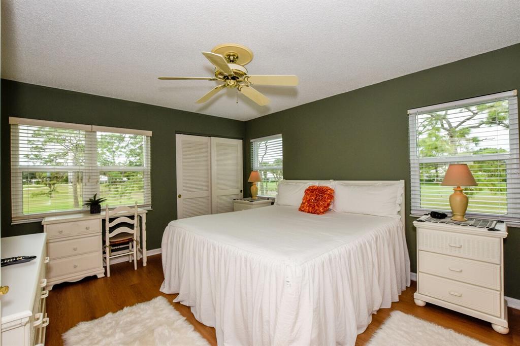 433 Cerromar Lane, Unit 438 Venice, FL 34293 - Photo 14 of 44 a bedroom with a bed and a large window