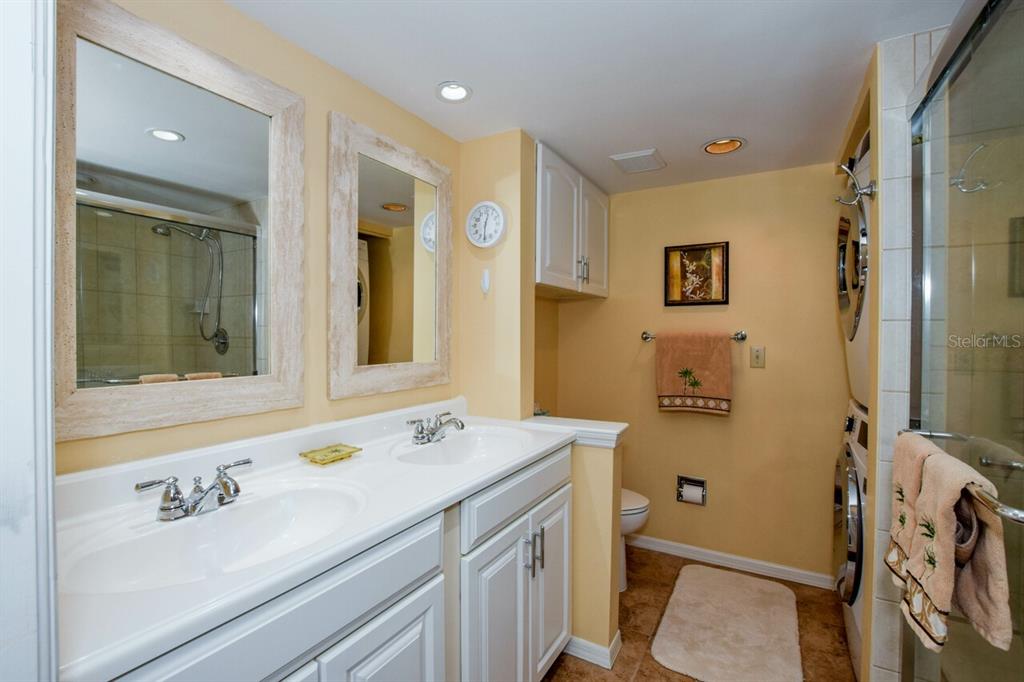 433 Cerromar Lane, Unit 438 Venice, FL 34293 - Photo 18 of 44 a bathroom with a sink mirror vanity and toilet